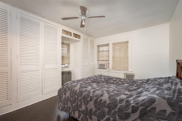 bedroom with hardwood / wood-style flooring, radiator, cooling unit, and ceiling fan