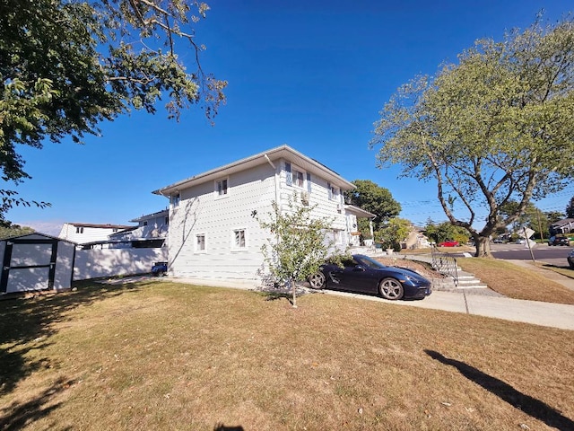 view of side of home featuring a yard