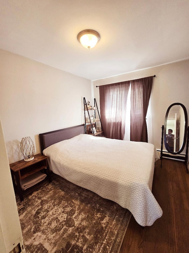 bedroom featuring dark hardwood / wood-style flooring