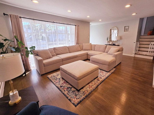 living room with dark hardwood / wood-style flooring