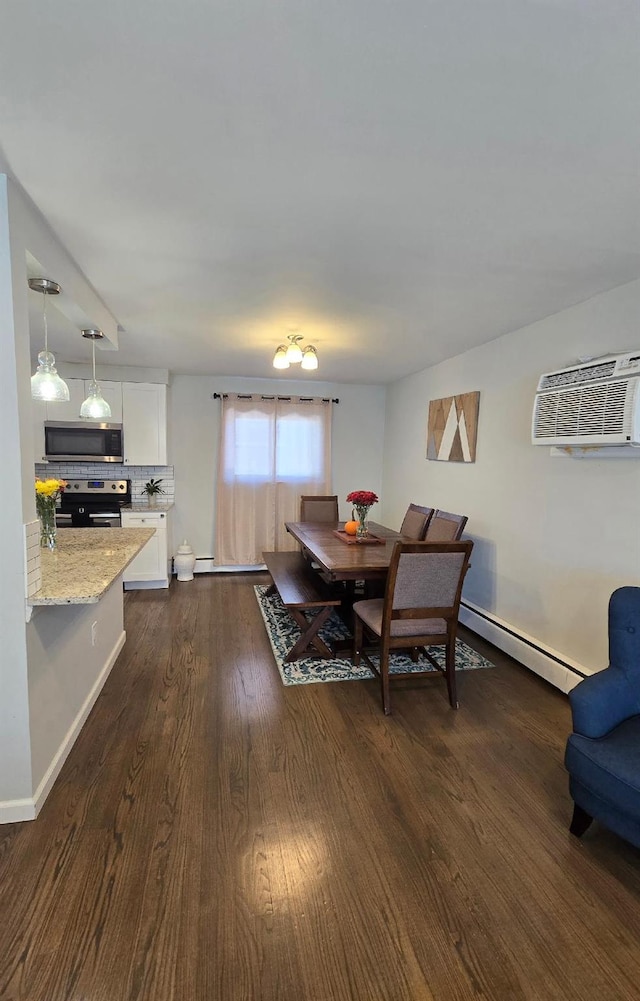 dining area with a wall mounted air conditioner, dark hardwood / wood-style flooring, and a baseboard heating unit