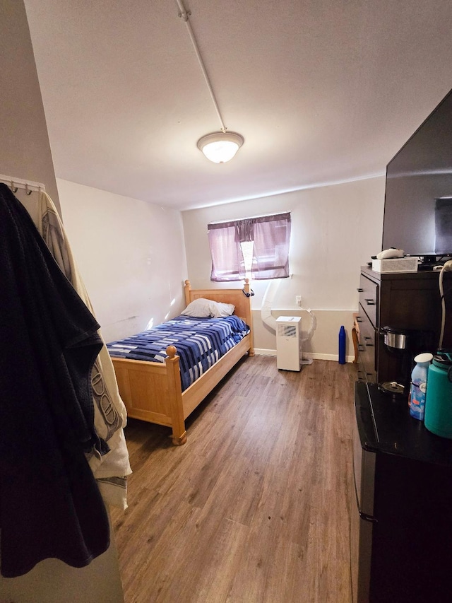 bedroom with wood-type flooring