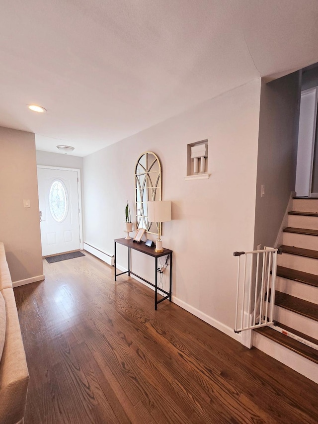 entrance foyer featuring dark hardwood / wood-style floors and a baseboard heating unit