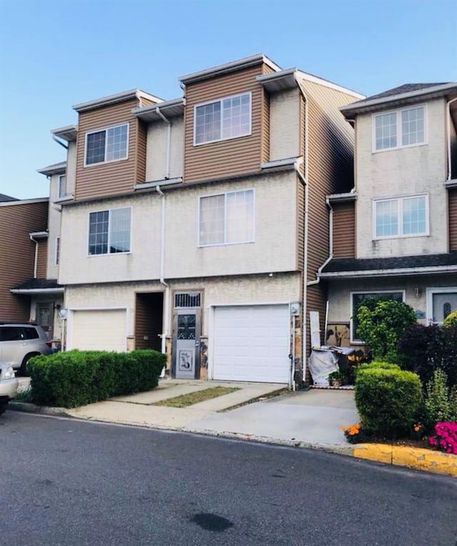 multi unit property featuring a garage