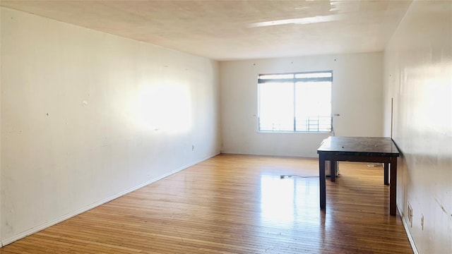 spare room featuring light hardwood / wood-style floors