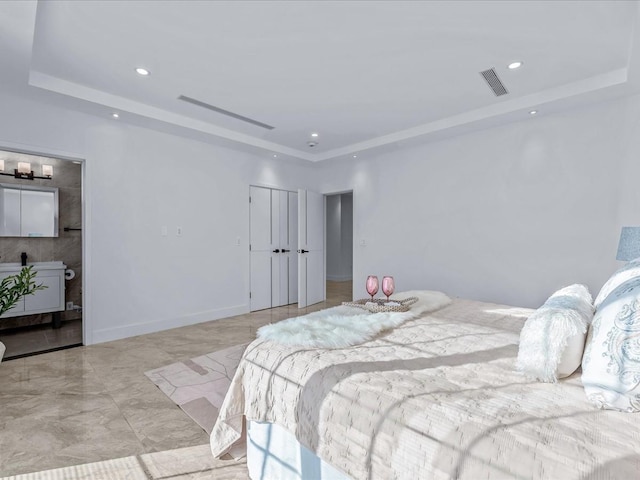 bedroom with a raised ceiling