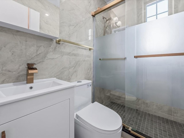 bathroom with an enclosed shower, vanity, and toilet