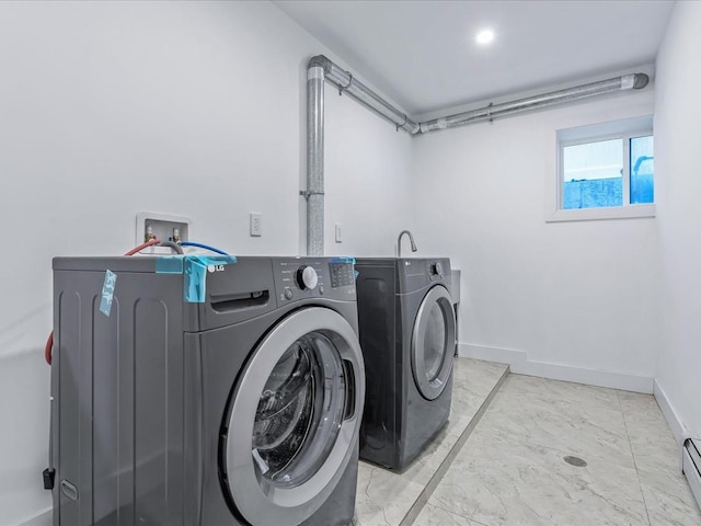 laundry room featuring a baseboard radiator and washer and clothes dryer