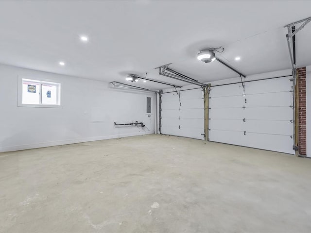 garage featuring electric panel and a garage door opener