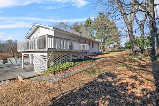 view of property exterior featuring a deck