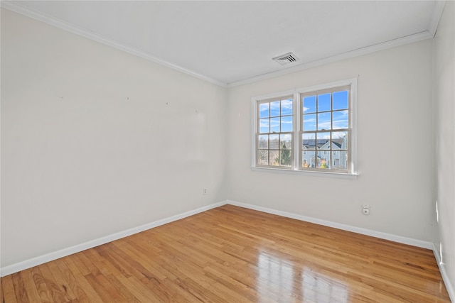 unfurnished room with light hardwood / wood-style floors and ornamental molding