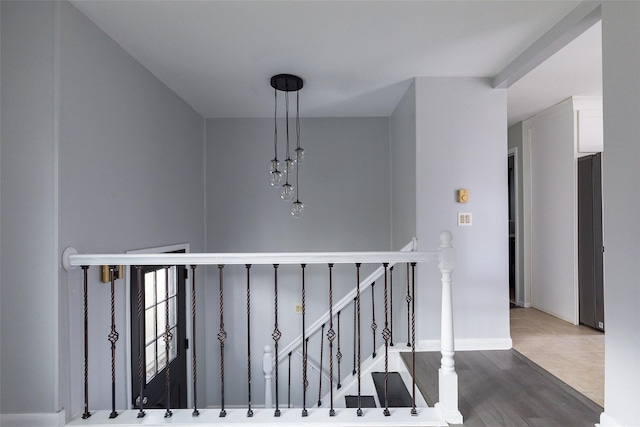 stairway featuring wood-type flooring