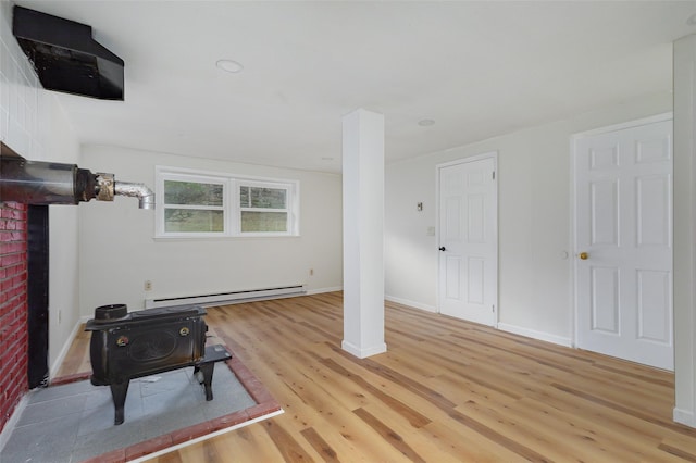 living room featuring baseboard heating and light wood-type flooring