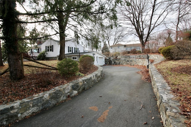 view of home's exterior with an outbuilding and a garage