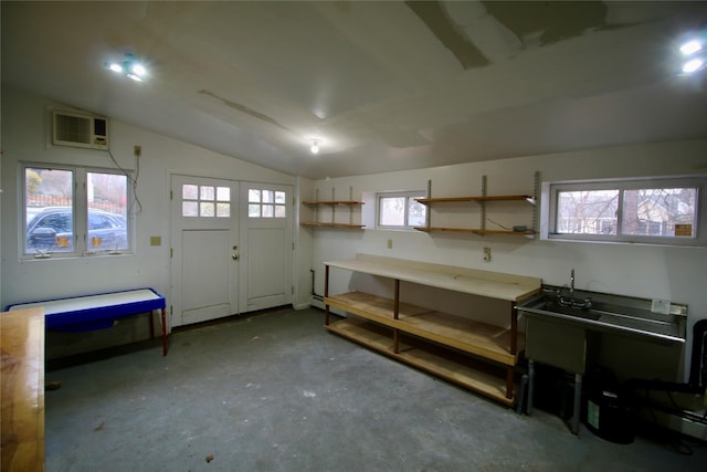 basement featuring a wall mounted air conditioner