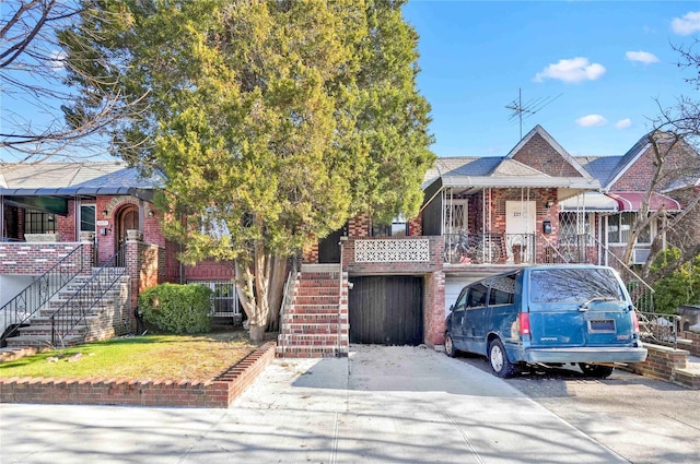 2273 E 27th St, Brooklyn, NY 11229 - view of front of property featuring stairs, brick siding, and roof with shingles