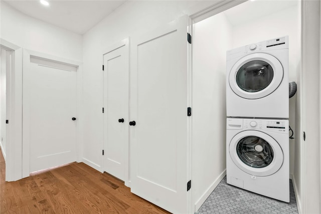 2273 E 27th St, Brooklyn, NY 11229 - washroom with estacked washer and dryer and wood finished floors