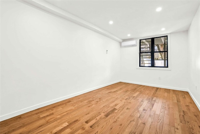 2273 E 27th St, Brooklyn, NY 11229 - spare room with a wall mounted air conditioner, light wood-type flooring, and recessed lighting