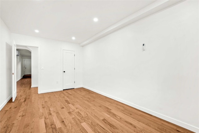 spare room featuring light hardwood / wood-style floors