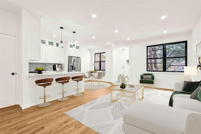 living room with light hardwood / wood-style floors