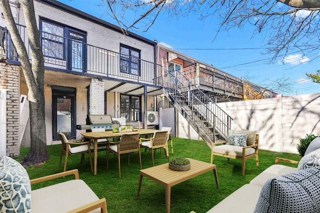 2273 E 27th St, Brooklyn, NY 11229 - back of house featuring a balcony, brick siding, stairs, and outdoor dining area
