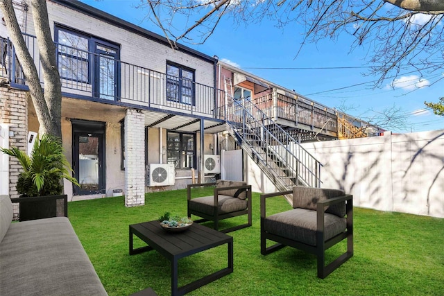 2273 E 27th St, Brooklyn, NY 11229 - rear view of house with brick siding, a balcony, and stairway