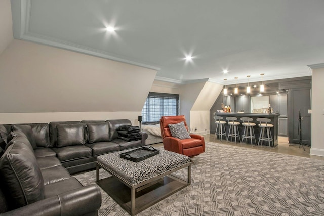 living room with indoor bar and crown molding