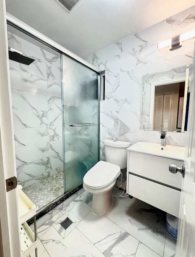 bathroom featuring vanity, a shower with shower door, tile walls, and toilet