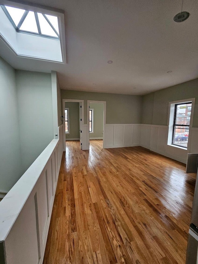 unfurnished room with light hardwood / wood-style floors