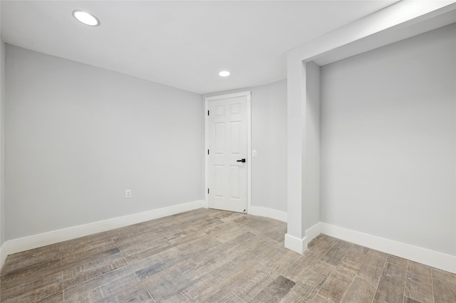 empty room with hardwood / wood-style flooring