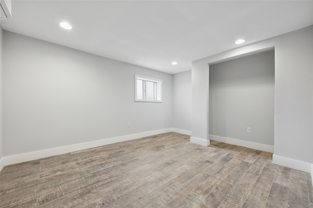 unfurnished room with light hardwood / wood-style floors