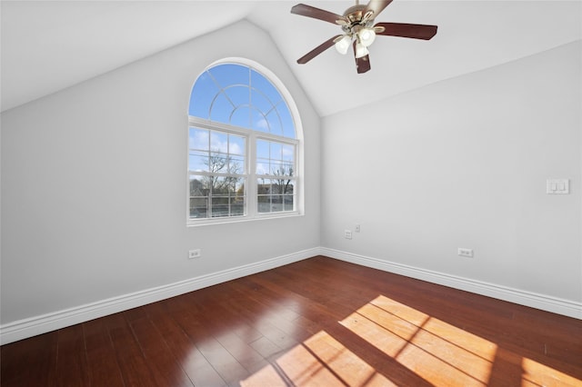 spare room with ceiling fan, wood-type flooring, and vaulted ceiling