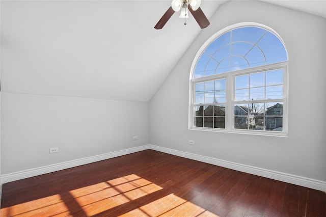 additional living space featuring hardwood / wood-style flooring, vaulted ceiling, and ceiling fan