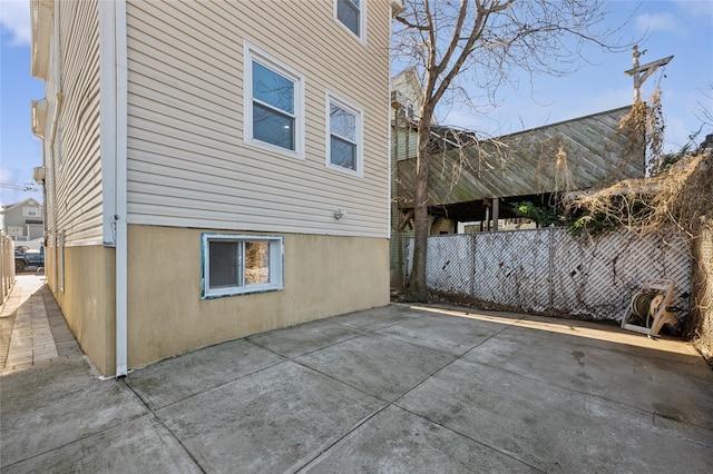 view of property exterior featuring a patio area