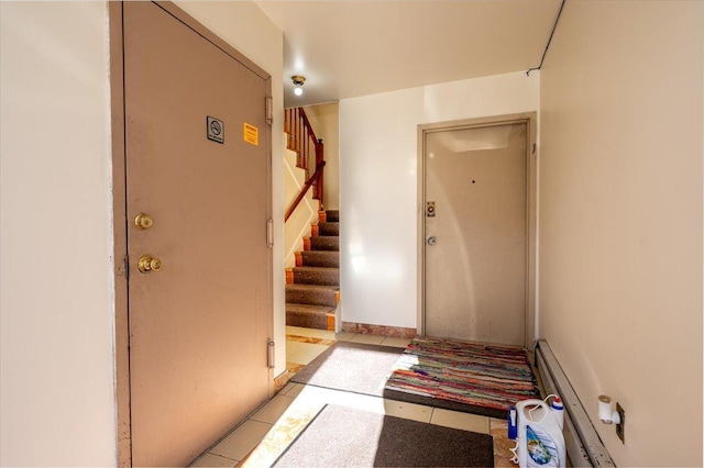 doorway to property with baseboard heating