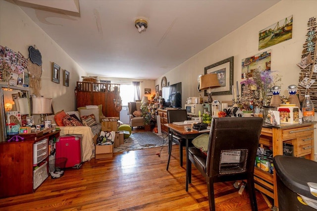 dining space with hardwood / wood-style flooring