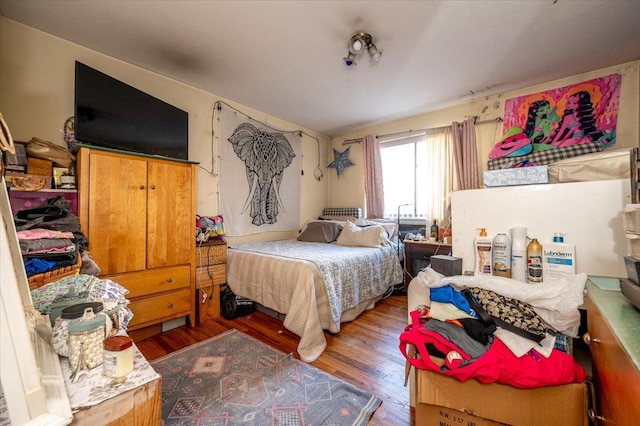 bedroom with hardwood / wood-style flooring