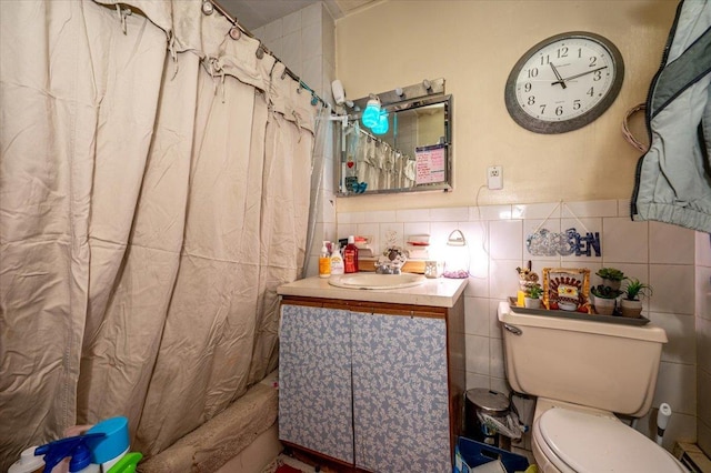 full bathroom with vanity, shower / bath combination with curtain, toilet, and tile walls