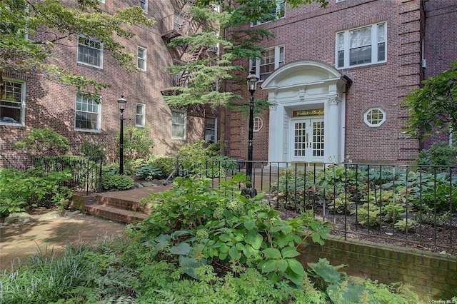 property entrance featuring french doors