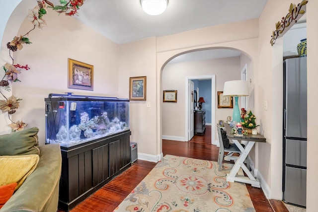 hall with dark hardwood / wood-style flooring