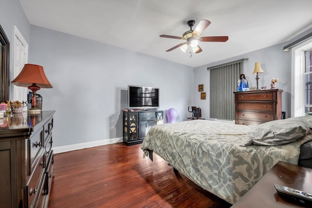 bedroom featuring ceiling fan and dark wood-type flooring