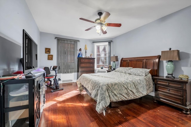 bedroom featuring ceiling fan and dark wood-type flooring