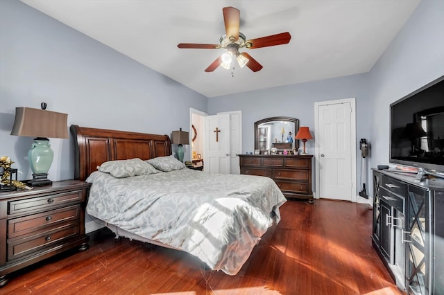 bedroom with ceiling fan and dark hardwood / wood-style floors