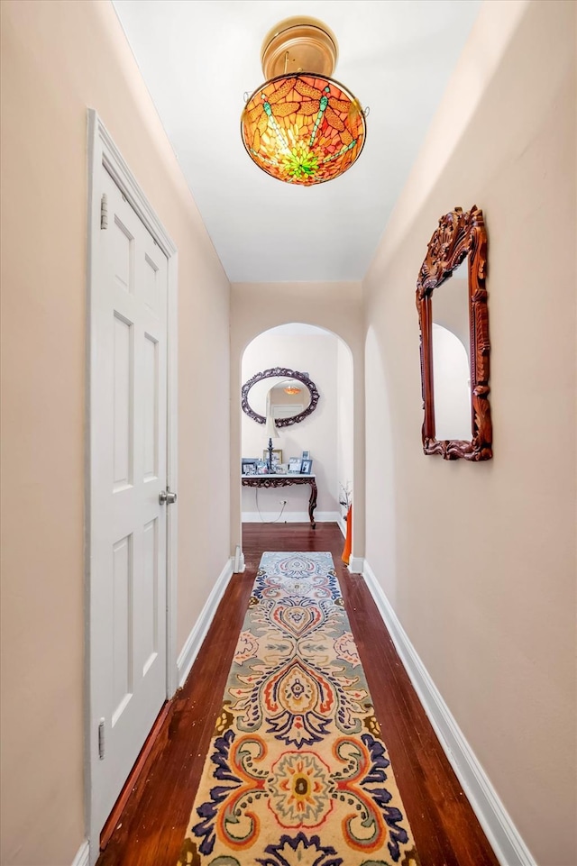 117-01 Park Ln S Unit B2L, Kew Gardens, NY 11415 - corridor featuring arched walkways, dark wood-type flooring, and baseboards