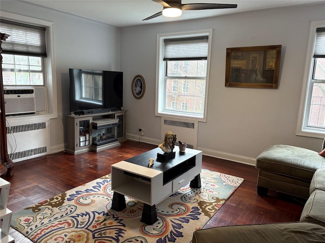 117-01 Park Ln S Unit B2L, Kew Gardens, NY 11415 - living area featuring cooling unit, wood finished floors, radiator heating unit, and ceiling fan