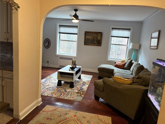 117-01 Park Ln S Unit B2L, Kew Gardens, NY 11415 - living area with radiator heating unit, arched walkways, and a wealth of natural light