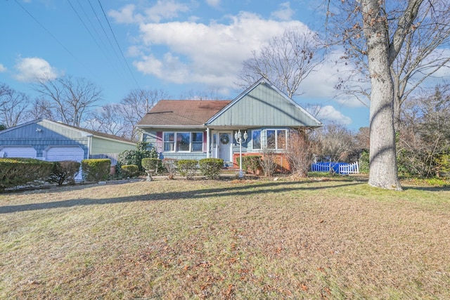 view of front facade featuring a garage and a front lawn