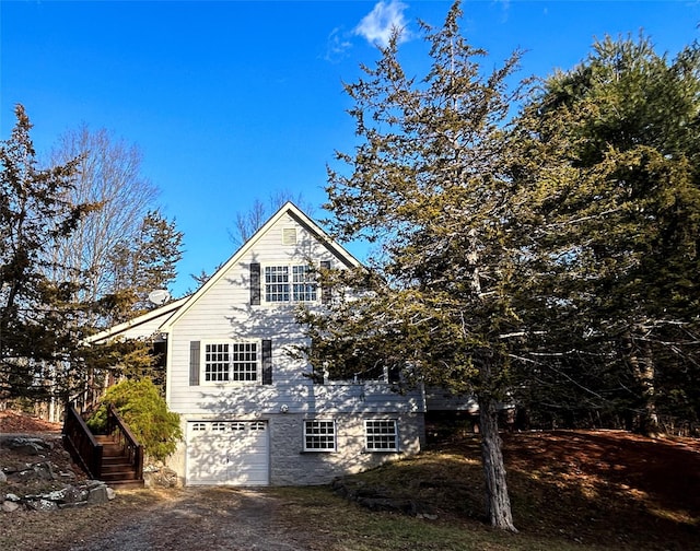 view of property exterior with a garage