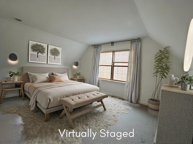 carpeted bedroom featuring lofted ceiling