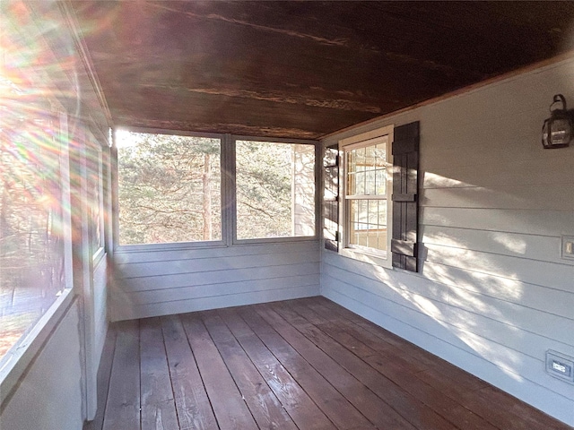 unfurnished sunroom featuring wood ceiling